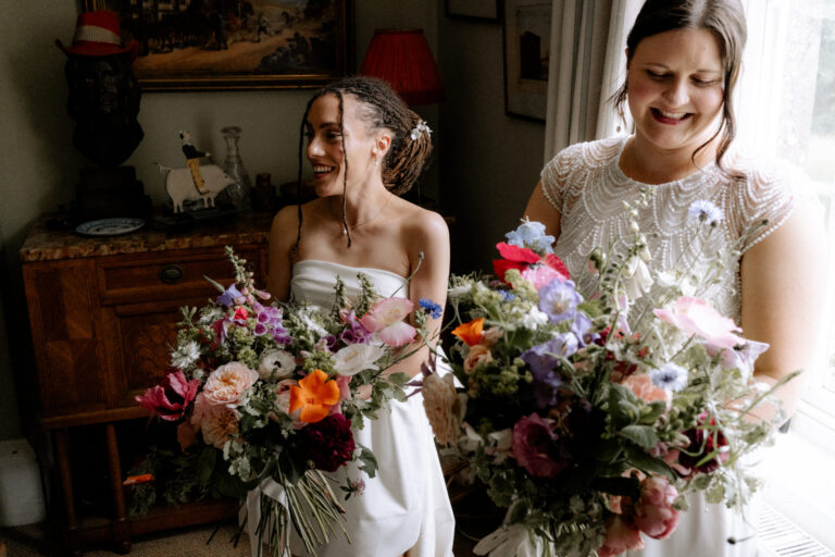 brides getting their bouquets in the house at The Secret Barn before heading in to their ceremony.